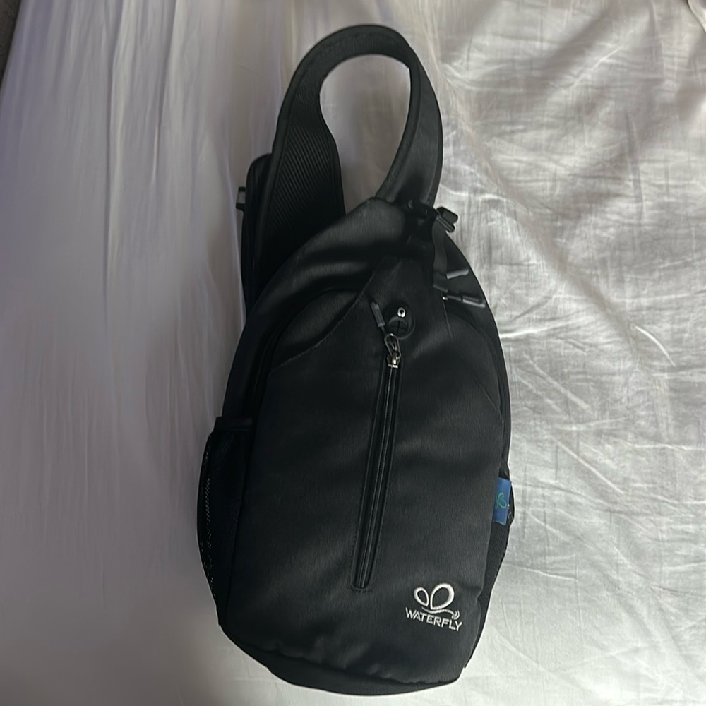 Waterfly black cross body hiking bag.